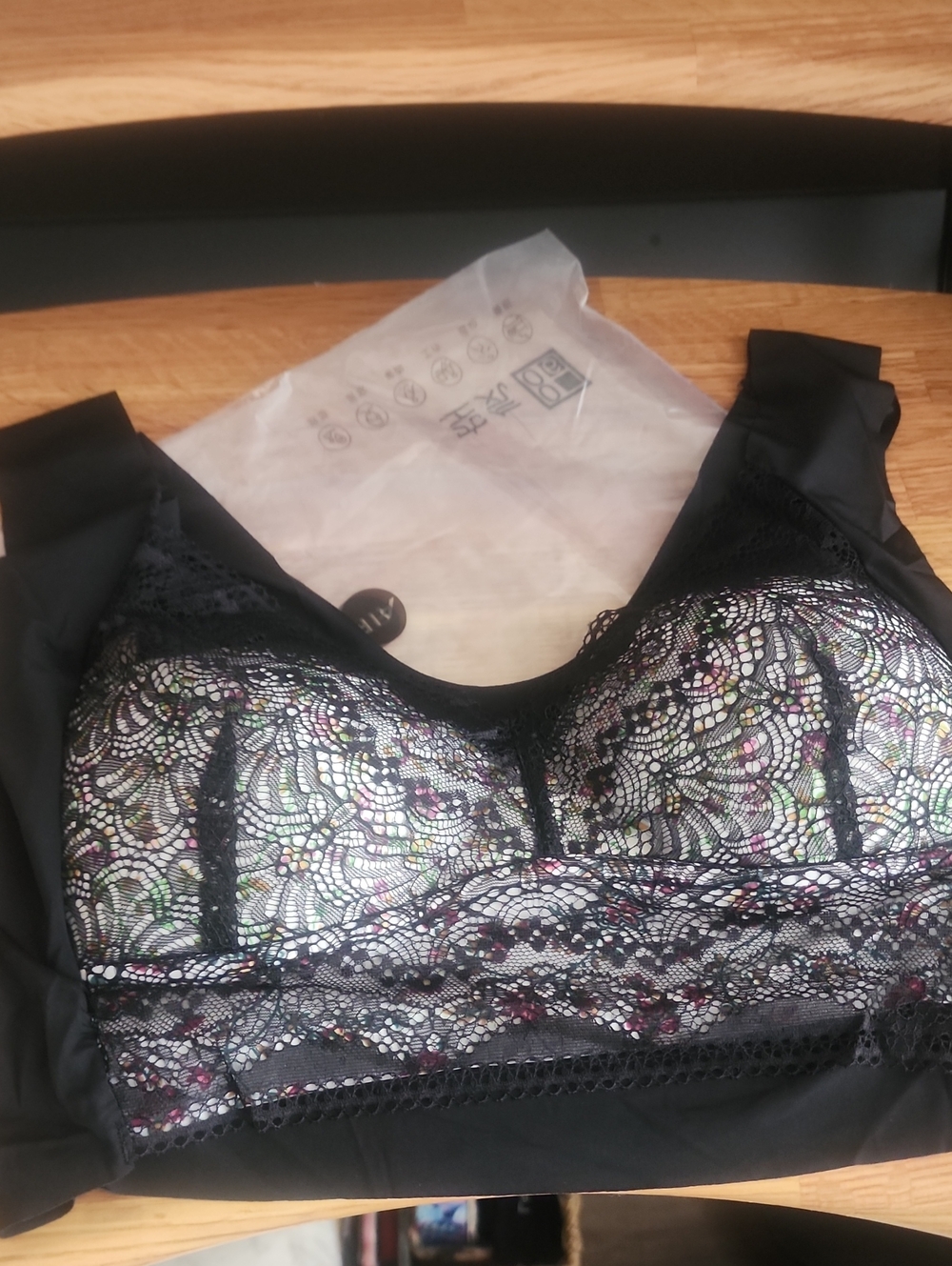 NEW. 36C+/D. Black Lace Bralette with Multicolor Underlay